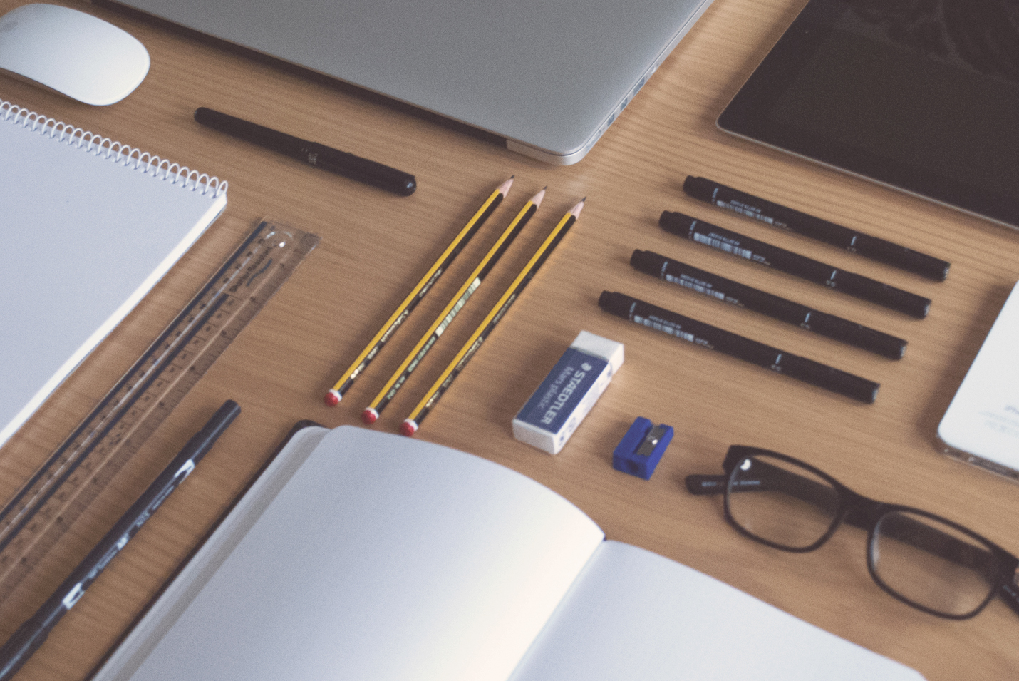 Pencils and Pens on desk