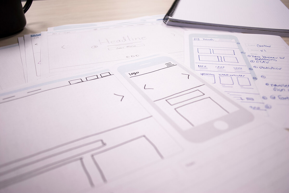 ux notepad sketches laid out on a table