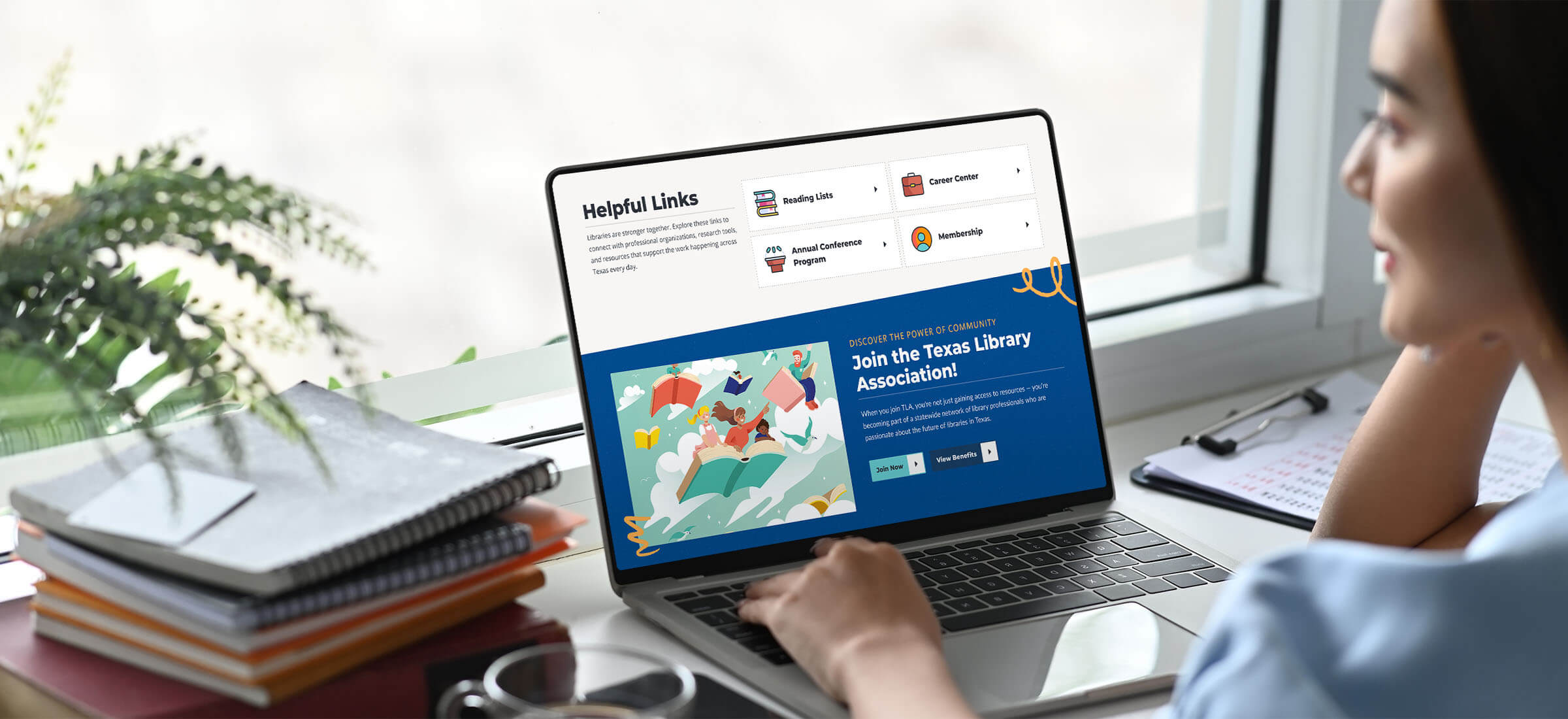 A woman sits at a desk using a laptop displaying the Texas Library Association website.