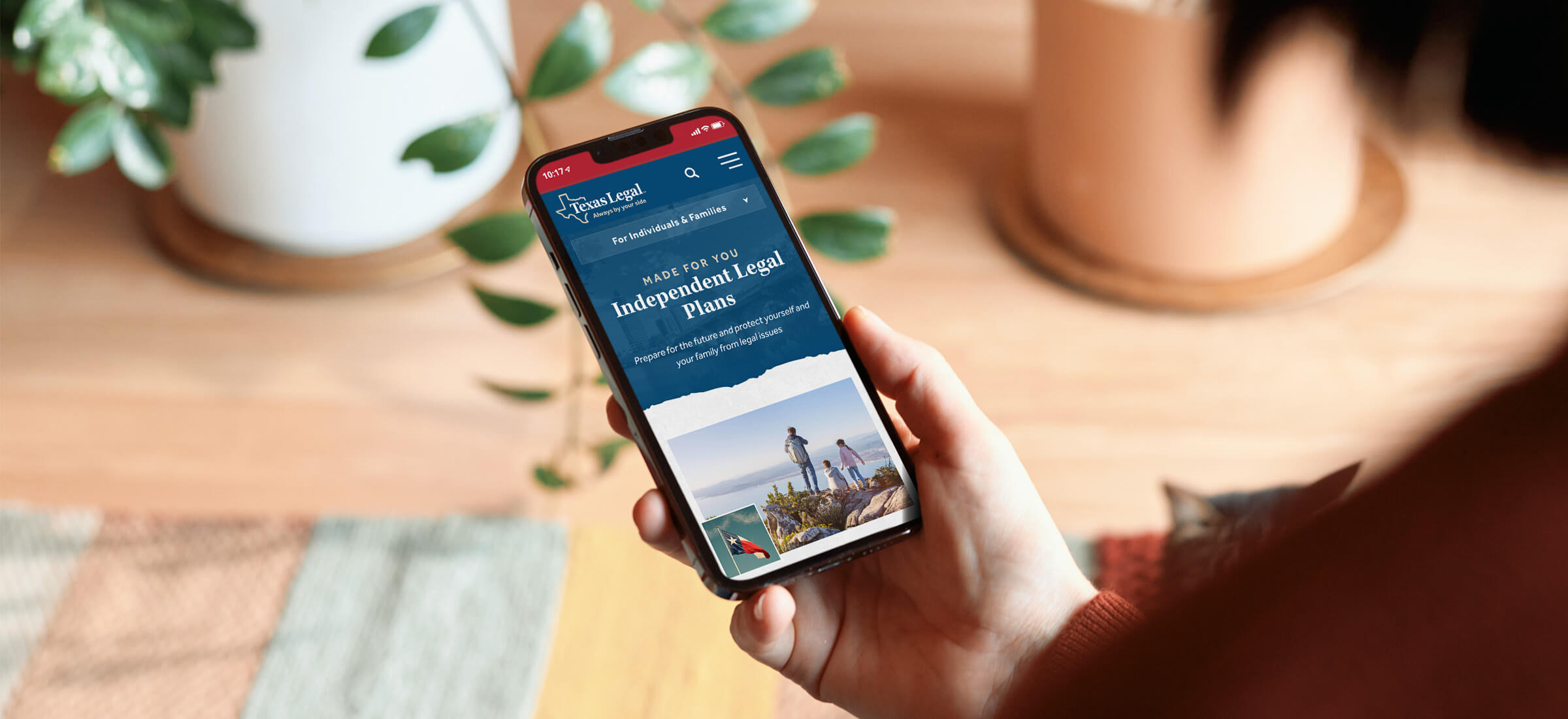A person on their phone looking at the Texas Legal independent legal plans