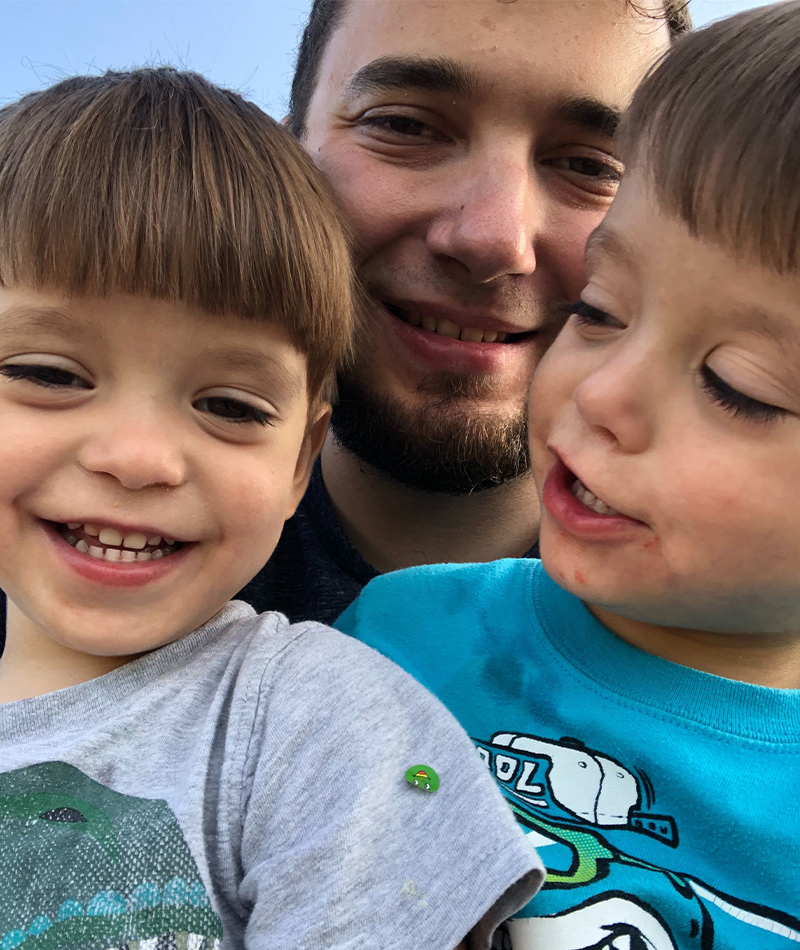 Brandon with his twin boys ready to take a selfie.